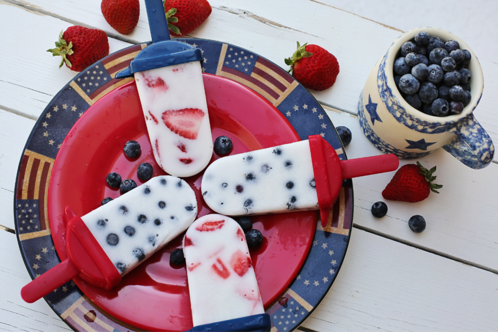 Red, white, and blue yogurt popsicles are a cheap and delicious treat for the Fourth of July.
