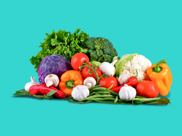 Keeping a variety of vegetables, like those pictured here with this teal background, on hand is one of the many ways to encourage healthy eating for kids.